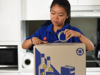 woman doing expert western sydney packing and packaging inside of a home that's moving to another home